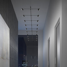 Load image into Gallery viewer, Suspenders® In-Line Linear LED Pendant Light in living room.
