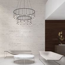 Load image into Gallery viewer, Suspenders® Ring LED Pendant Light in living room.
