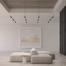 Load image into Gallery viewer, Suspenders® Tier Linear LED Pendant Light in living room.
