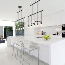 Load image into Gallery viewer, Suspenders® Tier Linear LED Pendant Light in dining room.
