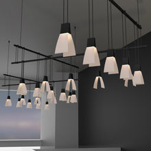 Load image into Gallery viewer, Suspenders® Zig Zag LED Pendant Light with Wings Luminaires in living room.
