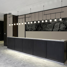 Load image into Gallery viewer, Suspenders®Offset Linear LED Pendant Light in room.
