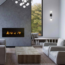 Load image into Gallery viewer, Mara LED Wall Light in living room.
