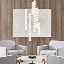 Load image into Gallery viewer, Orbet LED Pendant Light in living room.
