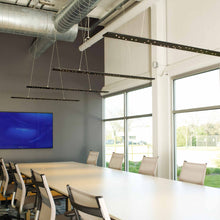 Load image into Gallery viewer, Parallax LED Linear Suspension Light in meeting room.
