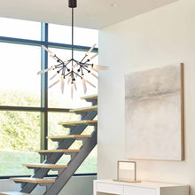 Load image into Gallery viewer, Spur LED Chandelier in living room.
