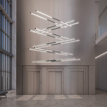 Load image into Gallery viewer, Tik-Tak™ Tiered LED Pendant Light in living room.

