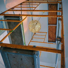 Load image into Gallery viewer, Etch Web Pendant Light in exhibition.
