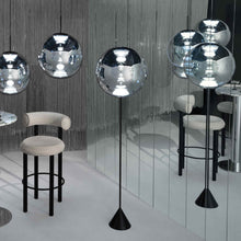 Load image into Gallery viewer, Globe LED Floor Lamp in exhibition.
