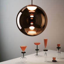 Load image into Gallery viewer, Globe LED Pendant Light in exhibition.
