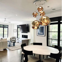 Load image into Gallery viewer, Melt Large LED Pendant Light in living room.
