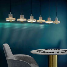 Load image into Gallery viewer, Stone LED Pendant Light in exhibition.
