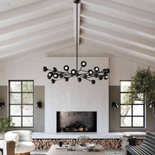 Load image into Gallery viewer, Colt Chandelier in living room.
