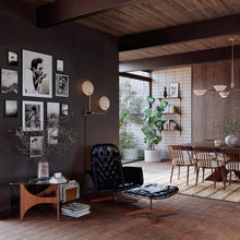 Load image into Gallery viewer, Leif Plug-In Wall Light in living room.

