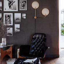 Load image into Gallery viewer, Leif Plug-In Wall Light in living room.
