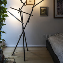 Load image into Gallery viewer, Tuareg LED Floor Lamp in bedroom.
