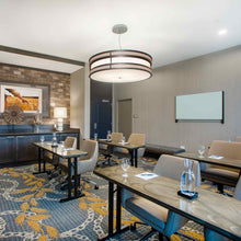 Load image into Gallery viewer, Duo Drum LED Pendant Light in restaurant.
