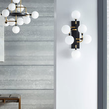 Load image into Gallery viewer, Viaggio Wall Light in living room.
