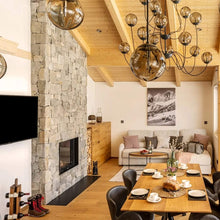 Load image into Gallery viewer, Puppet Chandelier in living room.
