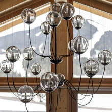 Load image into Gallery viewer, Puppet Chandelier in living room.
