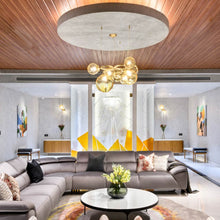 Load image into Gallery viewer, Puppet Ring Pendant Light in living room.
