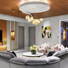 Load image into Gallery viewer, Puppet Ring Pendant Light in living room.
