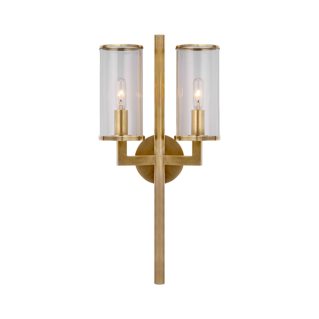 Liaison Double Wall Light in Antique-Burnished Brass/Clear.