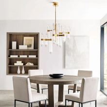Load image into Gallery viewer, Langston LED Chandelier in living room.
