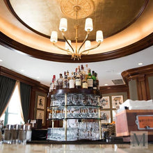 Load image into Gallery viewer, Ruhlmann Chandelier in living room.
