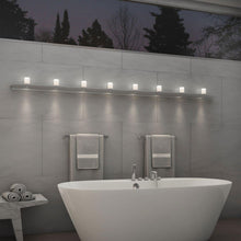 Load image into Gallery viewer, Votives™ LED Wall Light in bathroom.
