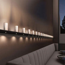 Load image into Gallery viewer, Votives™ LED Wall Light in living room.

