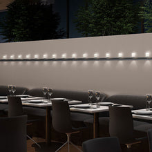 Load image into Gallery viewer, Votives™ LED Wall Light in dining room.
