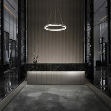 Load image into Gallery viewer, Sirius LED Pendant Light in living room.
