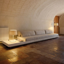 Load image into Gallery viewer, Warm Table Lamp in living room.
