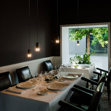 Load image into Gallery viewer, Wireflow Free-Form LED Pendant Light in dining room.
